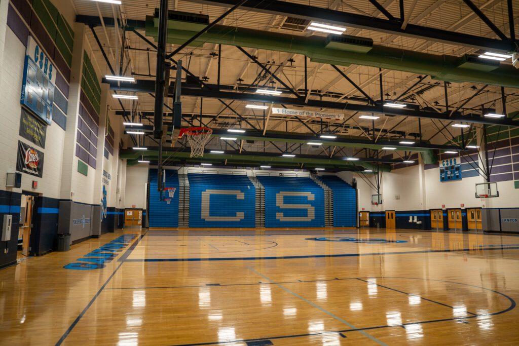 Roth Lighting successfully transformed Canyon High School's gymnasiums, implementing state-of-the-art, energy-efficient lighting solutions that enhance both the functionality and aesthetics of the athletic spaces.
